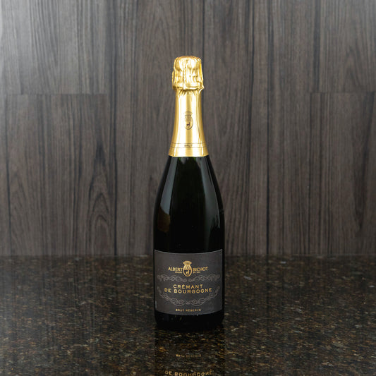 a bottle of Albert Bichot cremant de bourgogne in a dark bottle with a gold foil top