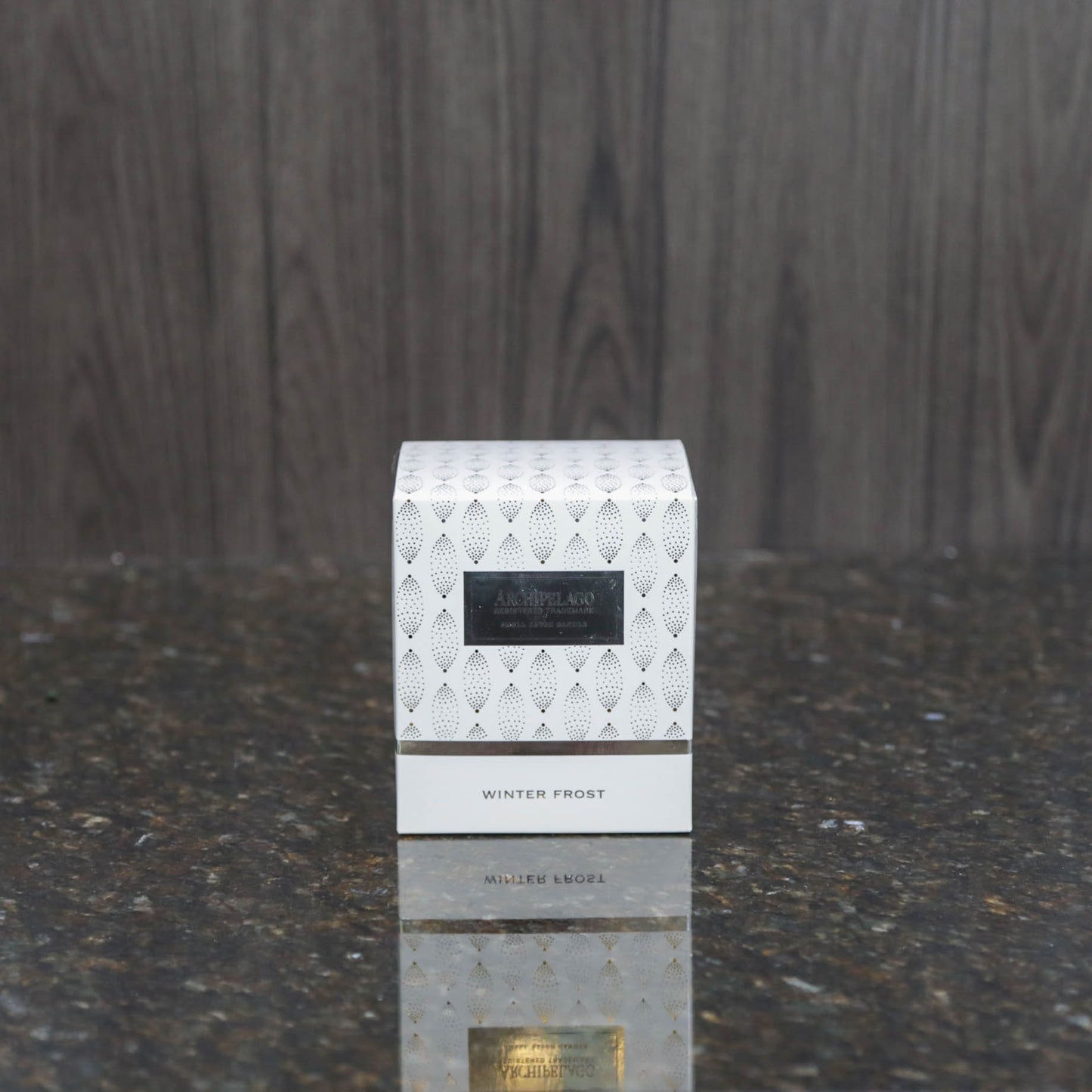 a white box with silver printed decorations