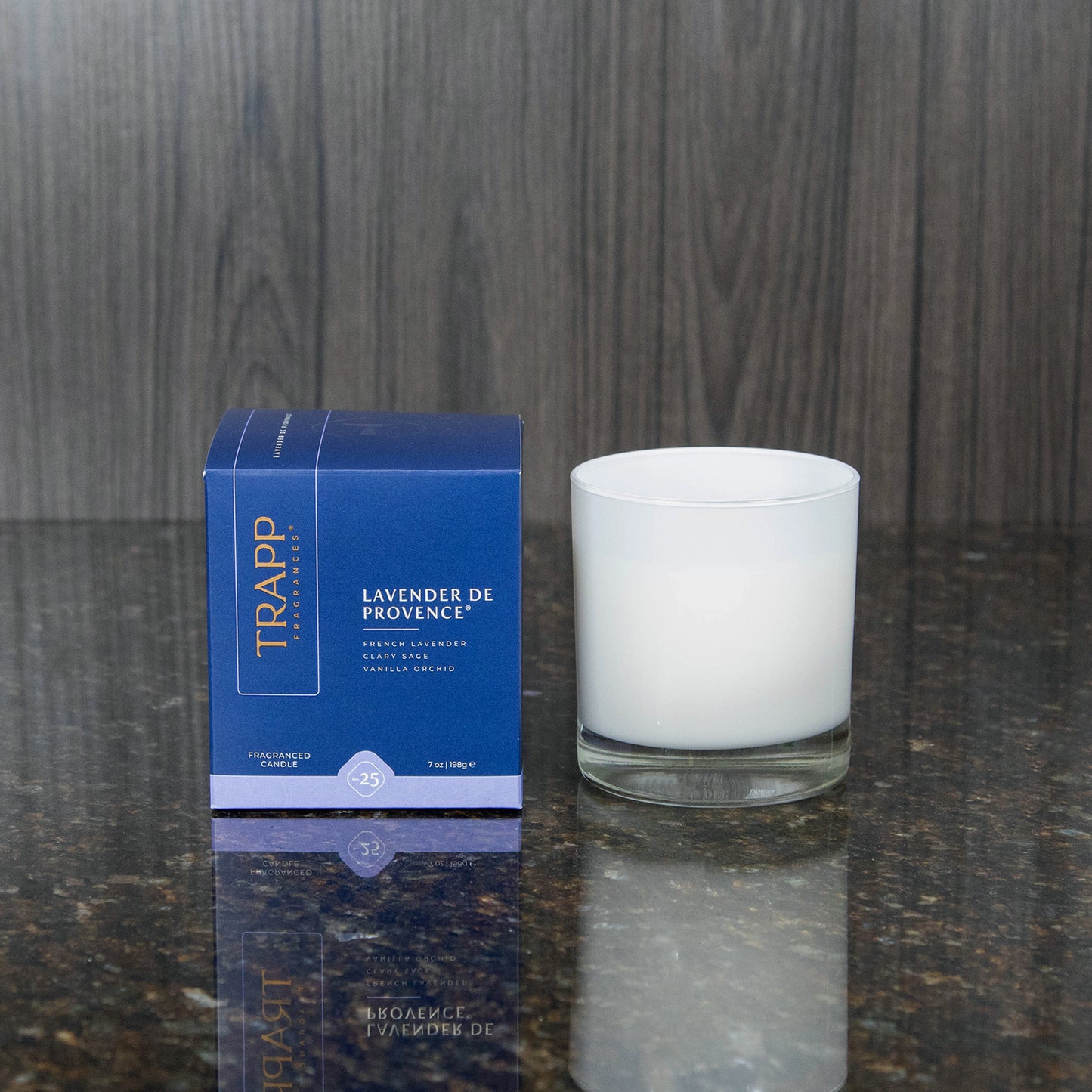 a white candle votive next to the "Lavender de Provence" box