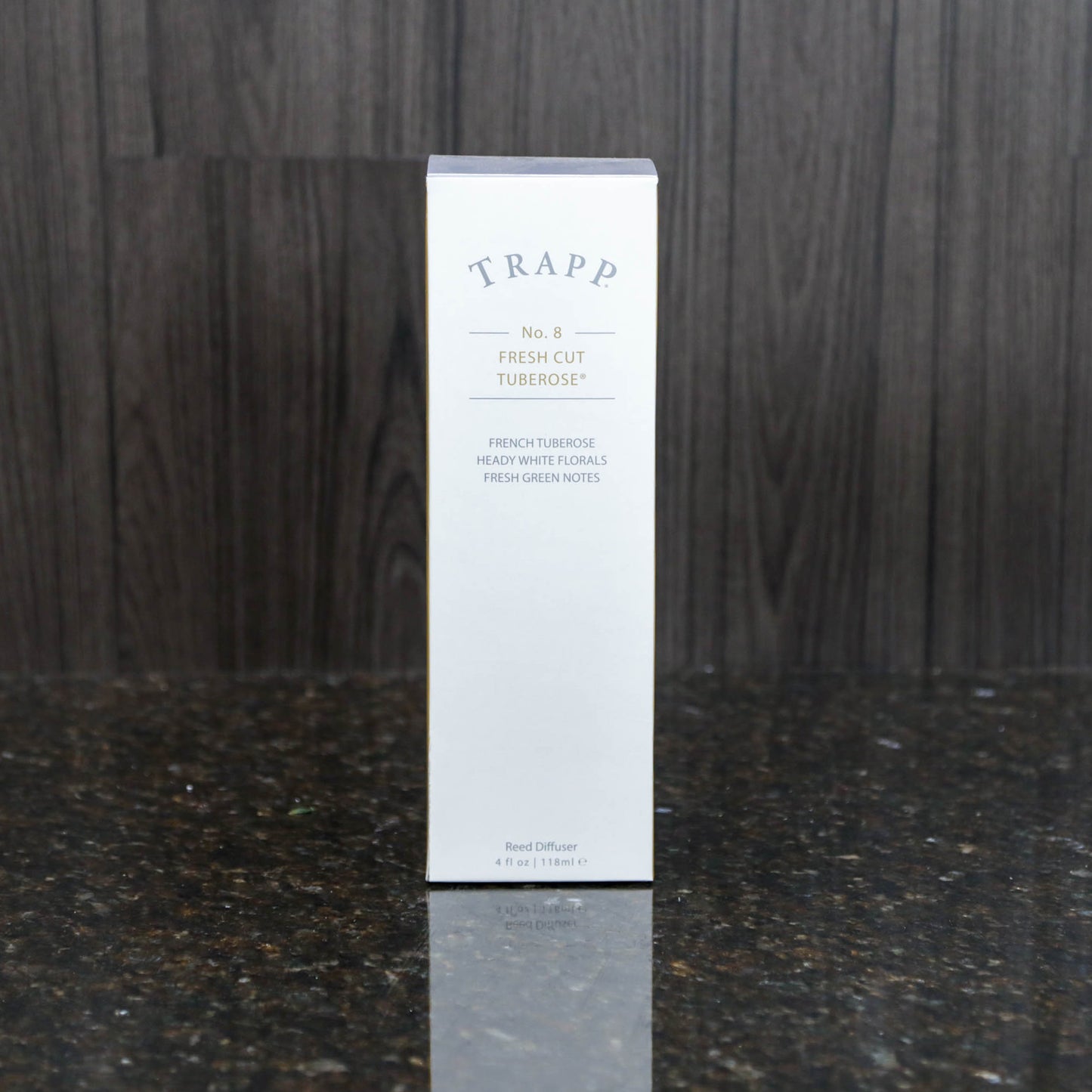 a reed diffuser kit from trapp fragrances in the white box it comes in