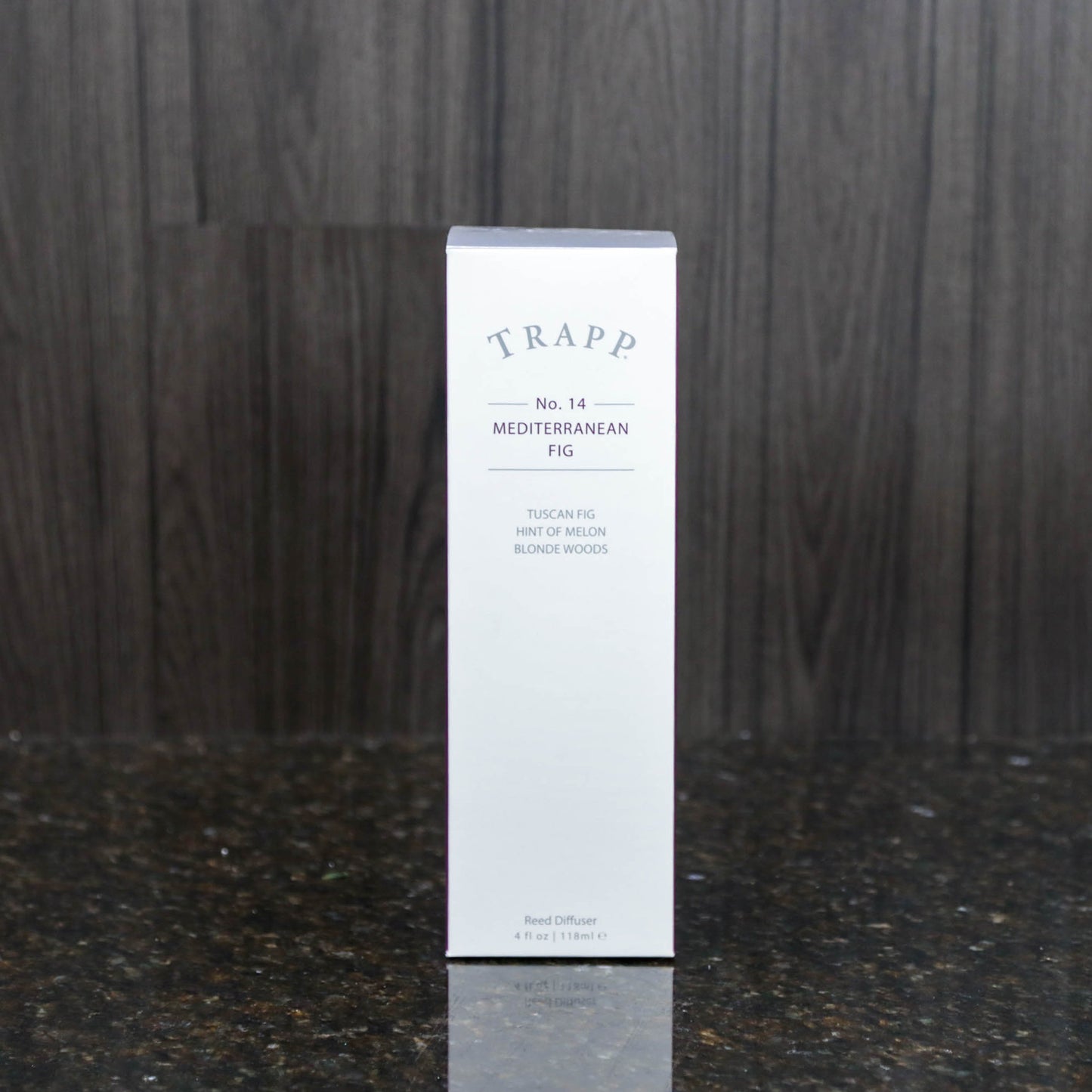 a reed diffuser kit from trapp fragrances in the white box it comes in