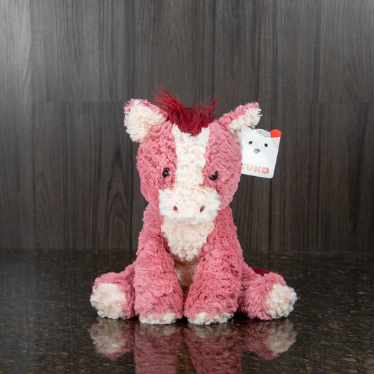 a pinkish red horse stuffed animal