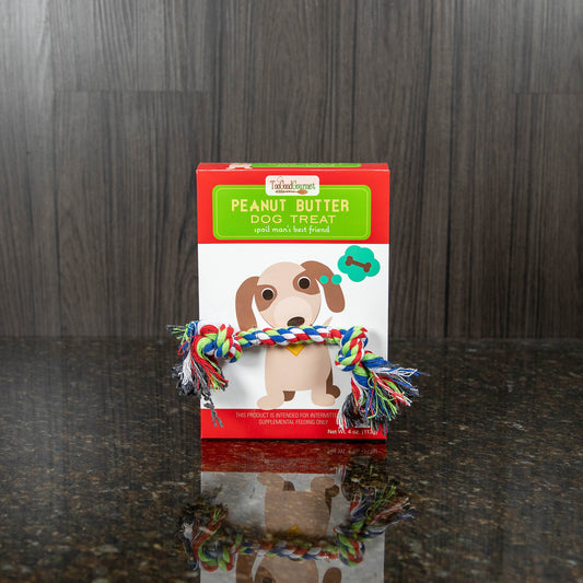 a package of peanut butter flavored dog treats with a rope toy attached to the front