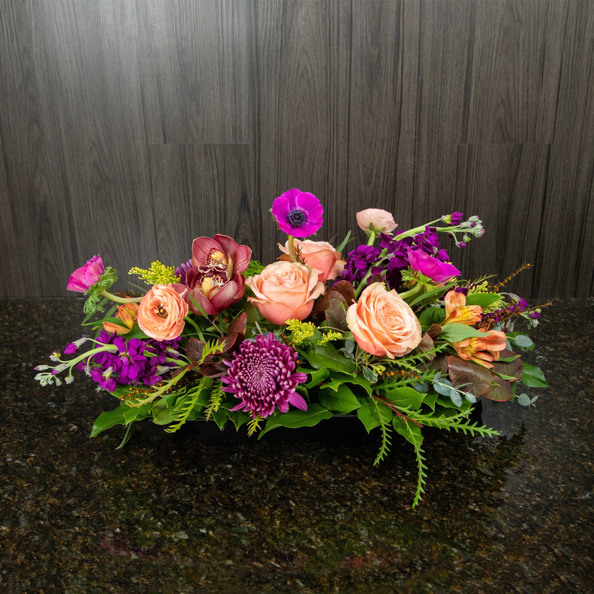a thanksgiving centerpiece with fall colors and pinks