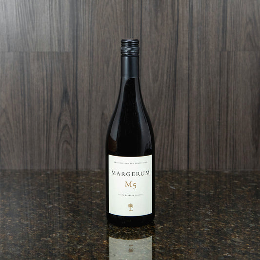 a bottle of a red blend wine with a black bottle and a white label