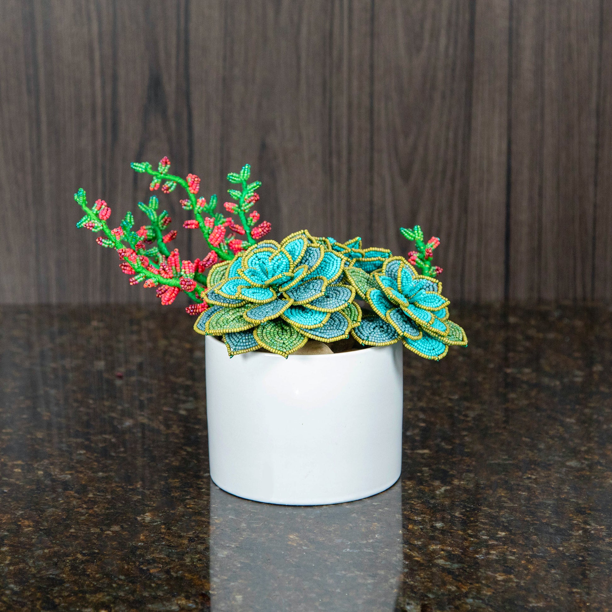 french beaded succulents in a white ceramic pot