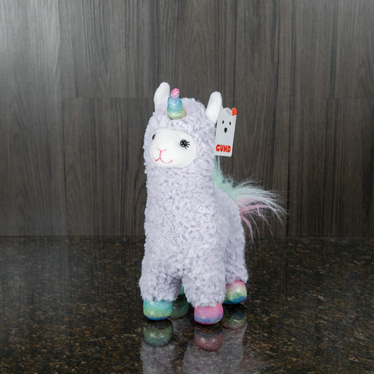 a purple plush llamacorn with rainbow hooves, a rainbow horn, and a rainbow mane and tail