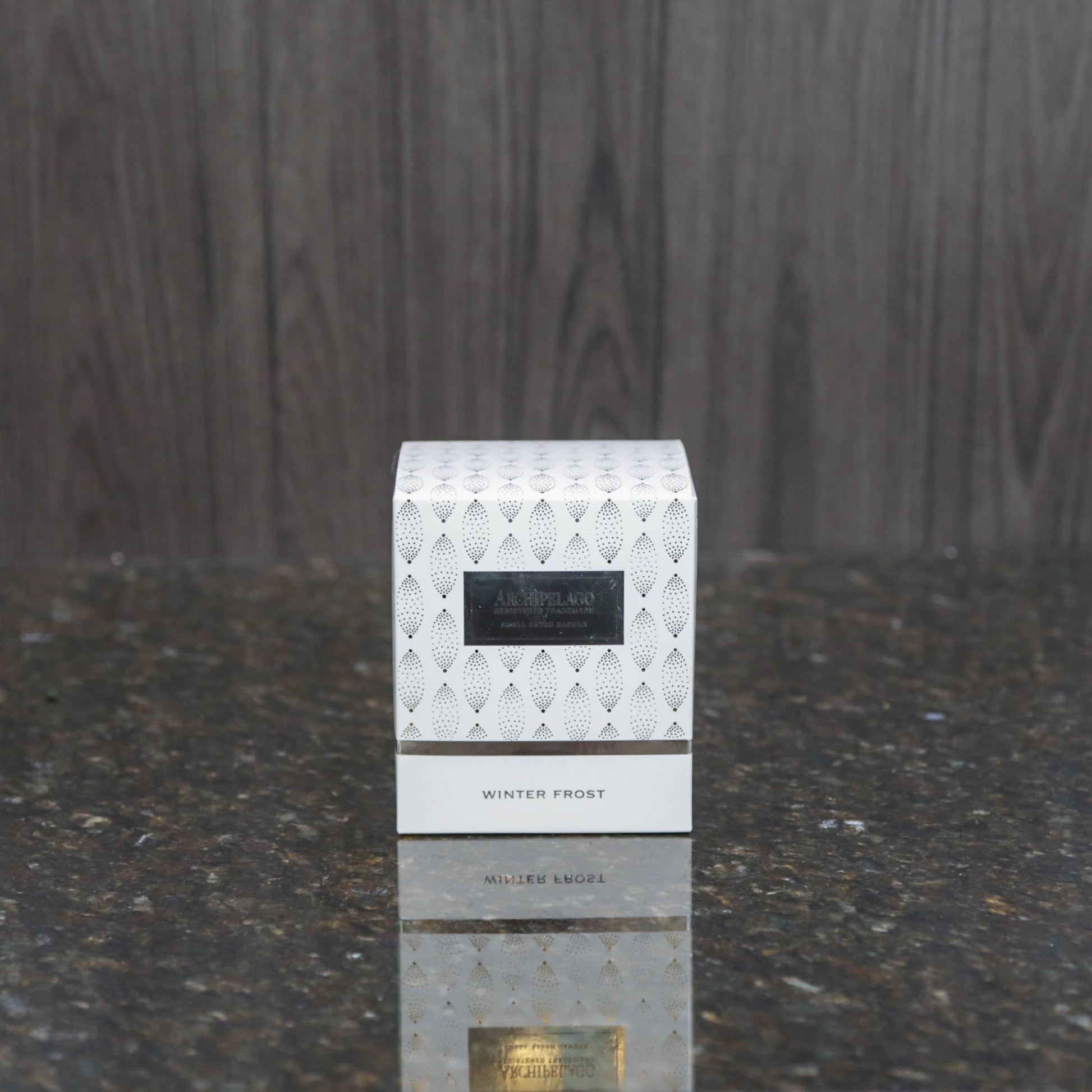 a white box with silver printed decorations
