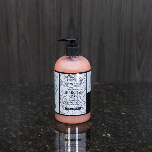 a soap pump with liquid soap in an opaque pink color