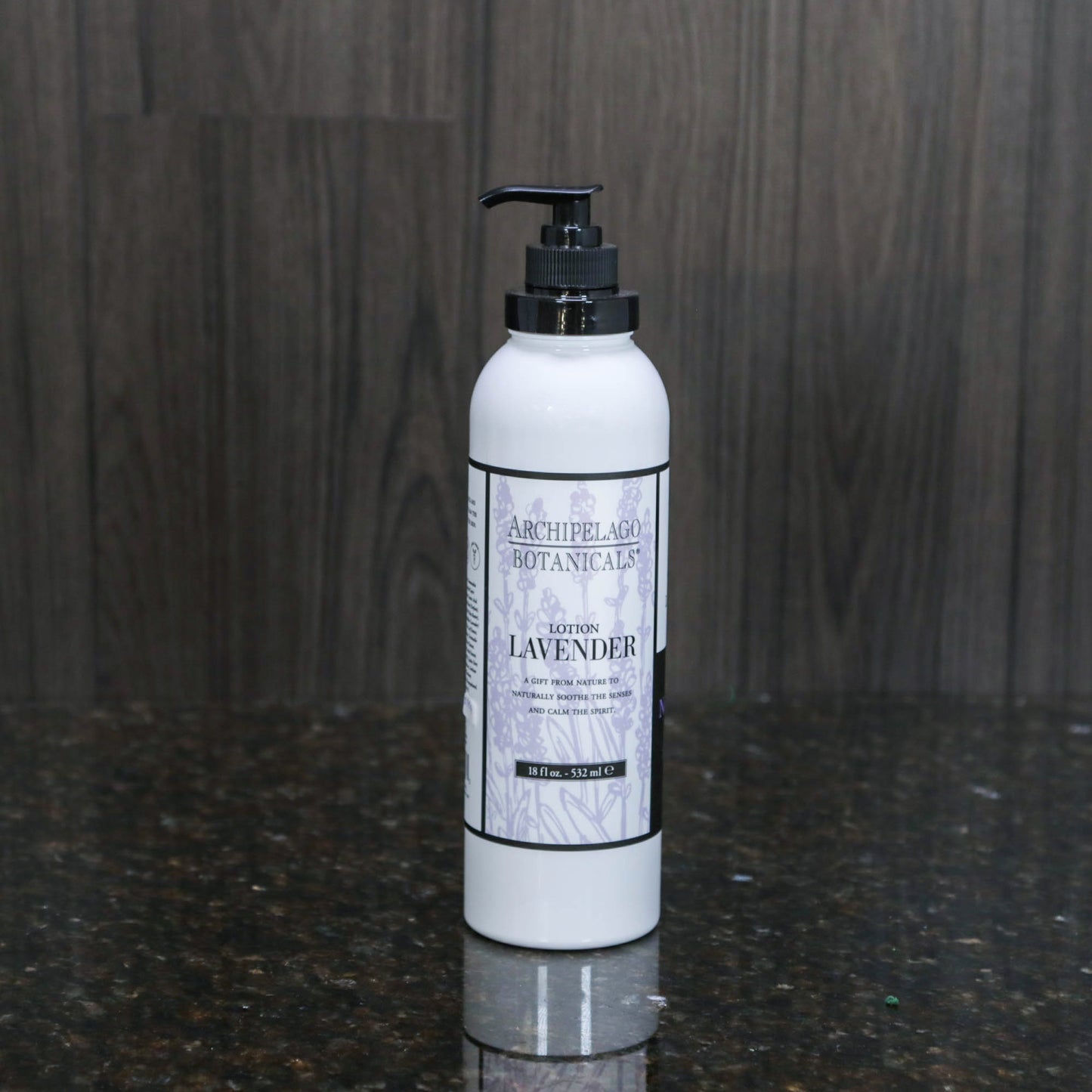 a white lotion bottle with a black pump