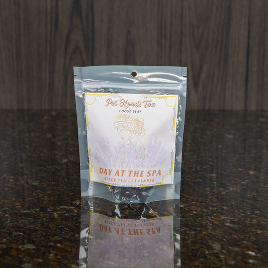 a packet of loose leaf tea with a pink label