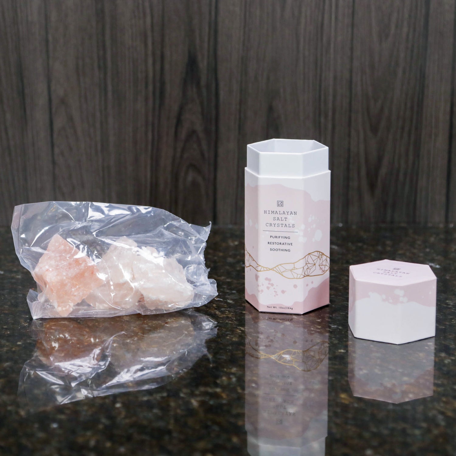 a light pink box next to the Himalayan salt crystals that come in it