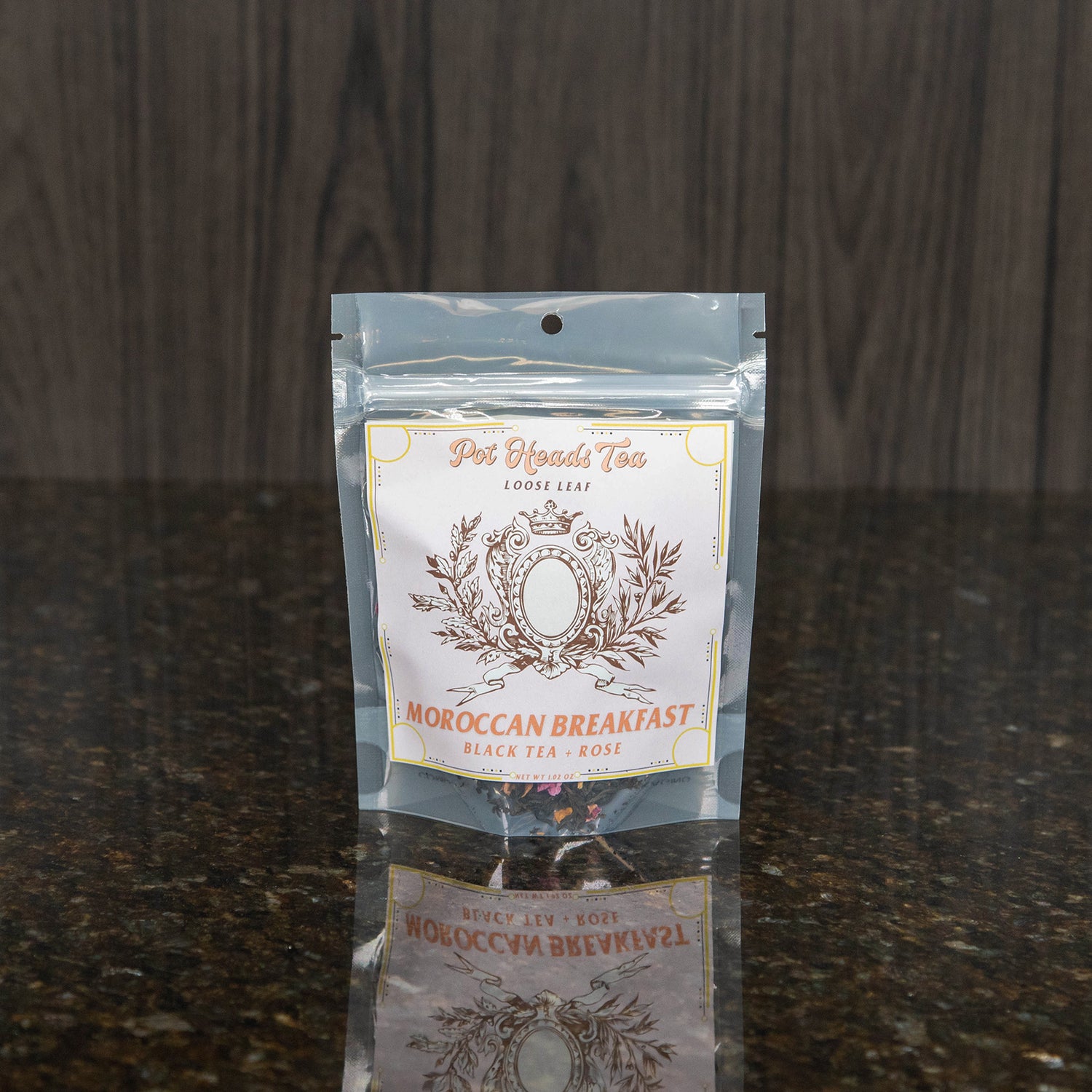 a packet of loose leaf tea with a pink label