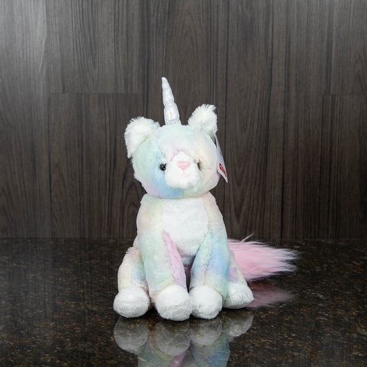 a rainbow plush cat with a silver iridescent horn and a big fluffy pink tail