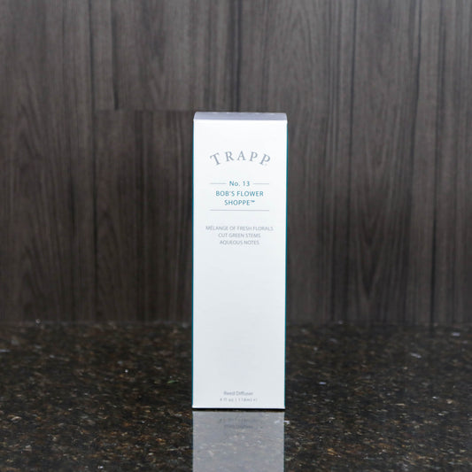 a reed diffuser kit from trapp fragrances in the white box it comes in