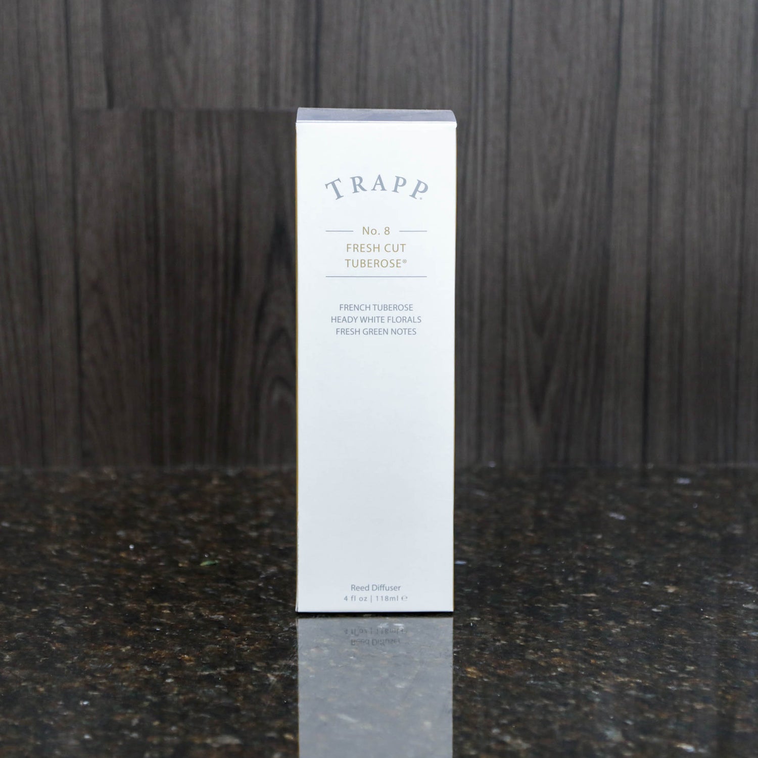 a reed diffuser kit from trapp fragrances in the white box it comes in