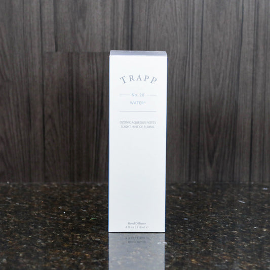 a reed diffuser kit from trapp fragrances in the white box it comes in