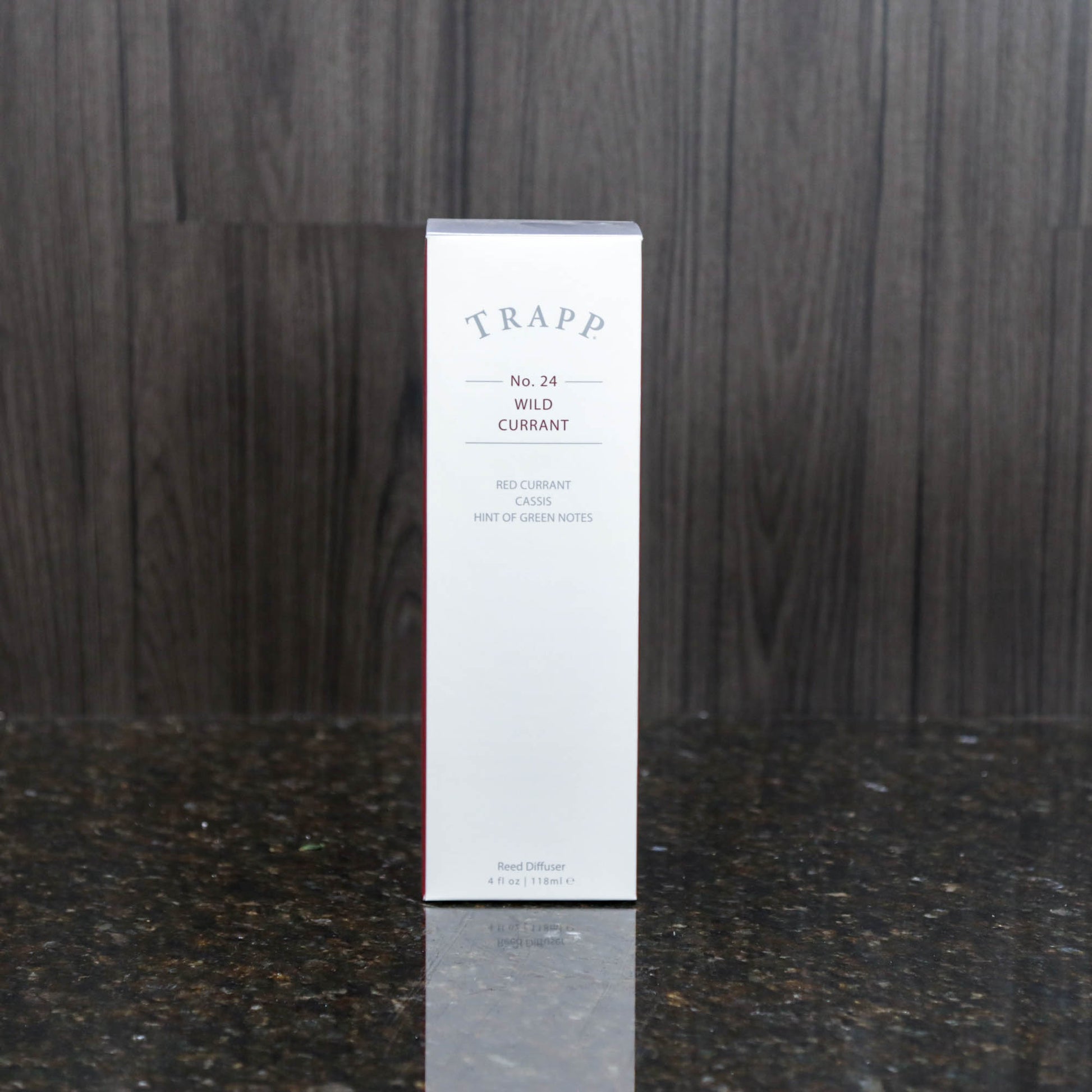 a reed diffuser kit from trapp fragrances in the white box it comes in