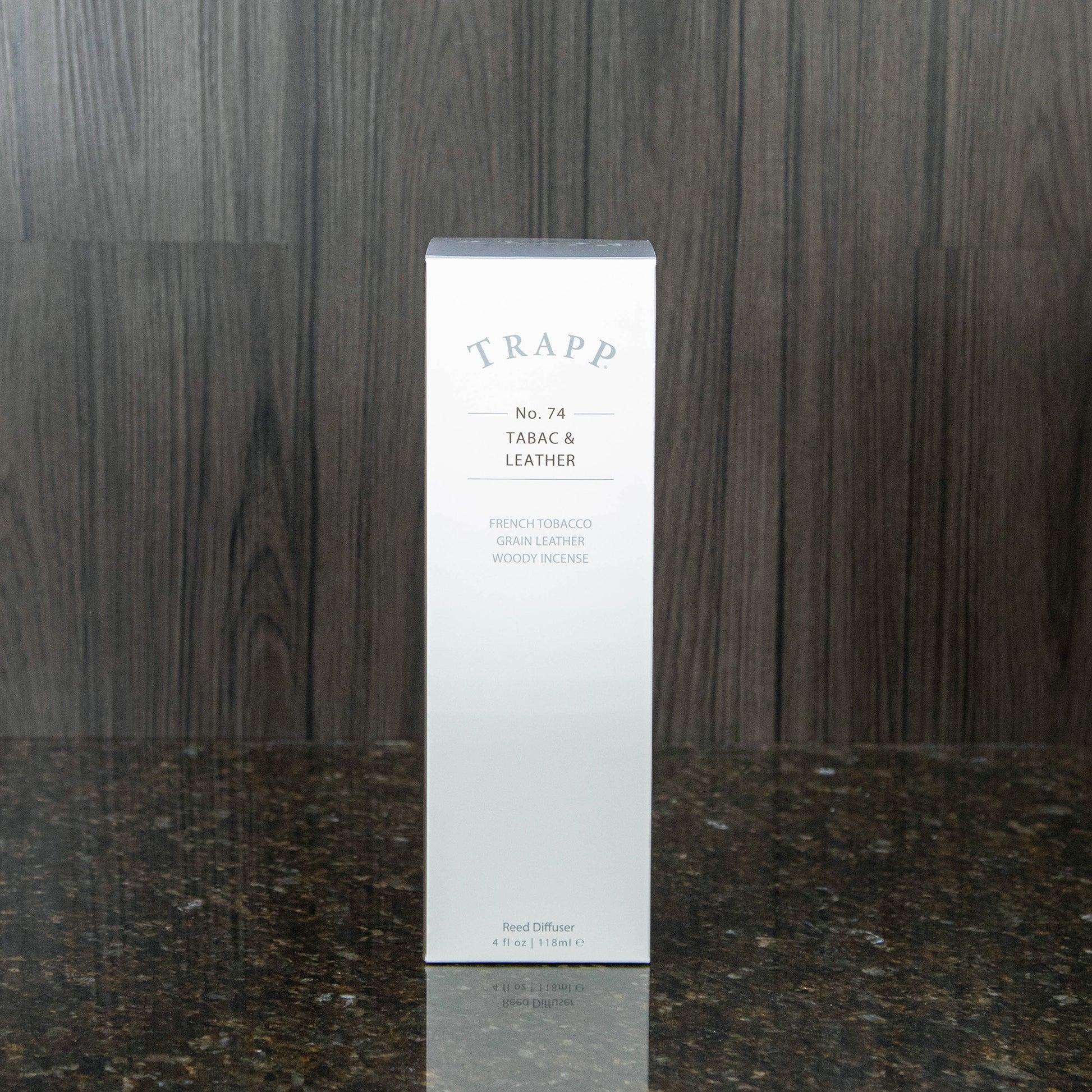 a reed diffuser kit from trapp fragrances in the white box it comes in
